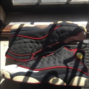 black, red, white jordan 13s